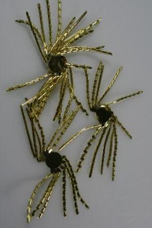 krullen met plakker goud doos @ 100 stuks