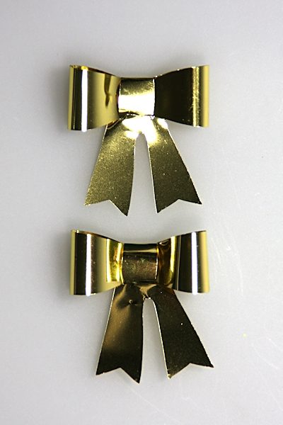 vlinderstrikje goud met plakker 4 cm doos @ 50
